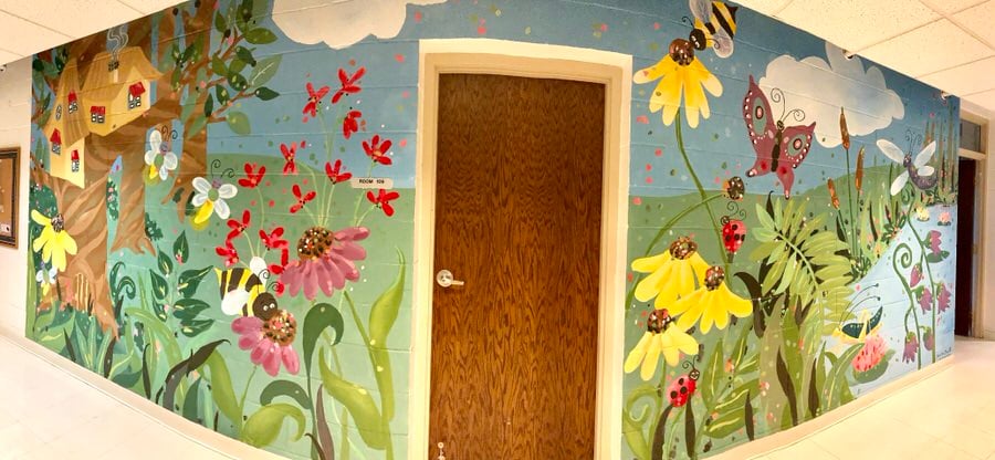 A vibrant children's mural in a hallway